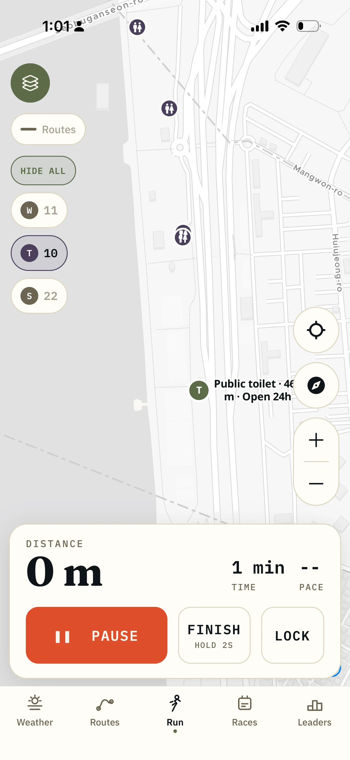 The run map with the toilets toggle selected and a tapped pin naming a public toilet, its straight-line distance and that it is open 24 hours