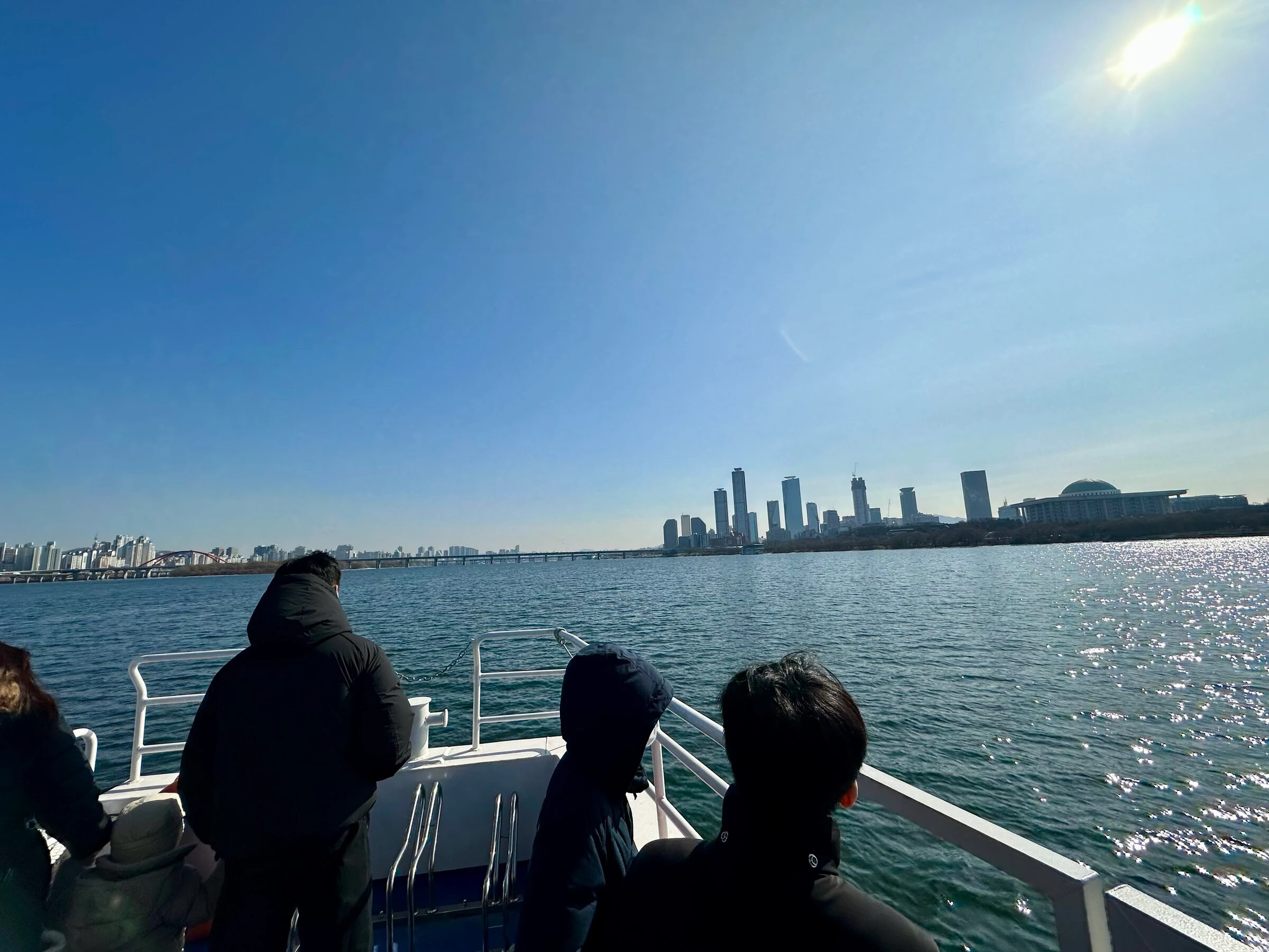 The Yeouido skyline across the Han River on a clear winter day.
